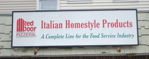 Sign on the Red Door Pizzeria building in New Britain, CT